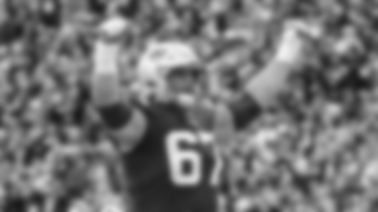New England Patriots center Ted Karras (67) celebrates a touchdown during the second half of an NFL football game against the Cleveland Browns, Sunday, Nov. 14, 2021, in Foxborough, Mass. (AP Photo/Stew Milne)