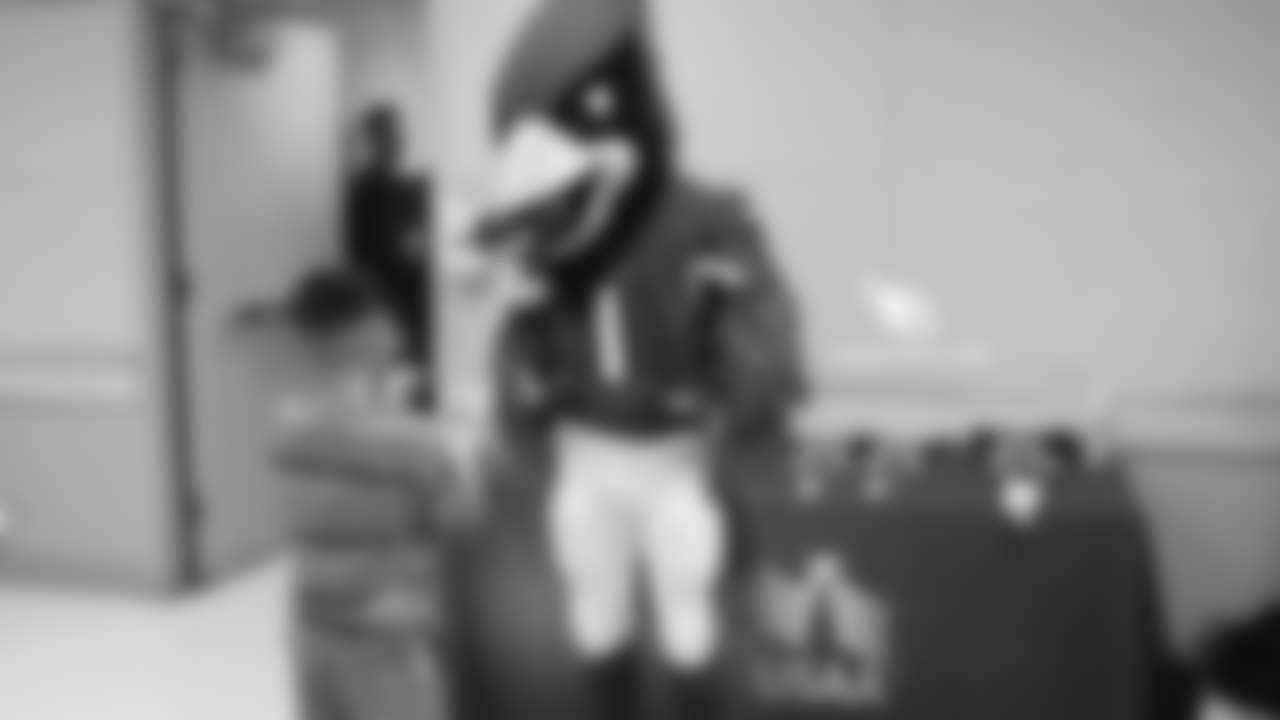 Big Red entertains a young fan