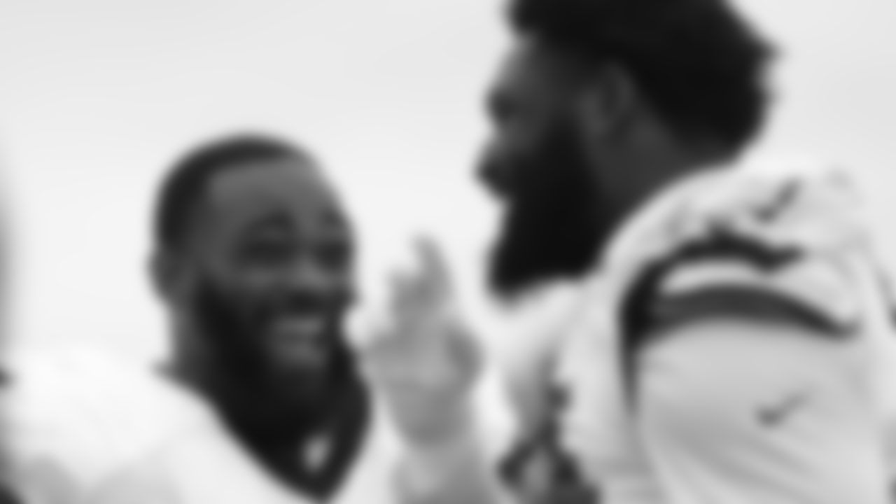 Pro Bowl DEs Brandon Graham and Josh Sweat share a laugh.