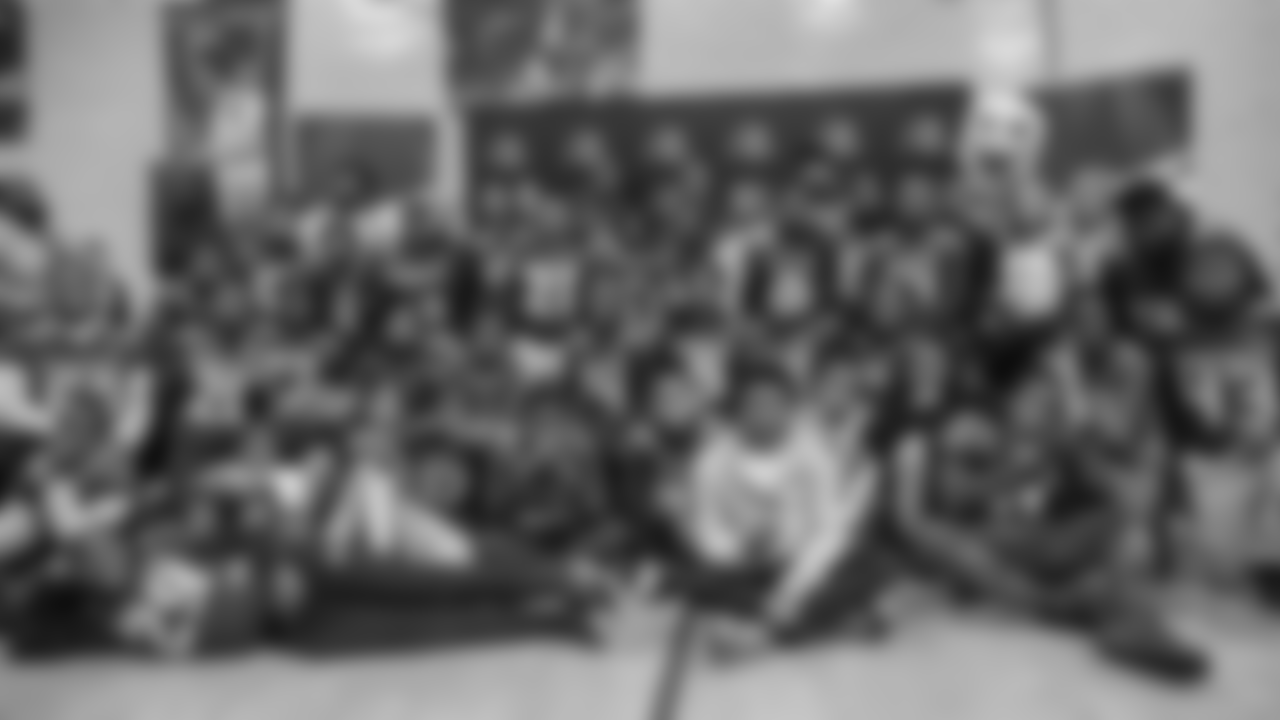 The players, Eagles Cheerleaders, and SWOOP posed for photos with all of the youth football and cheerleading teams.