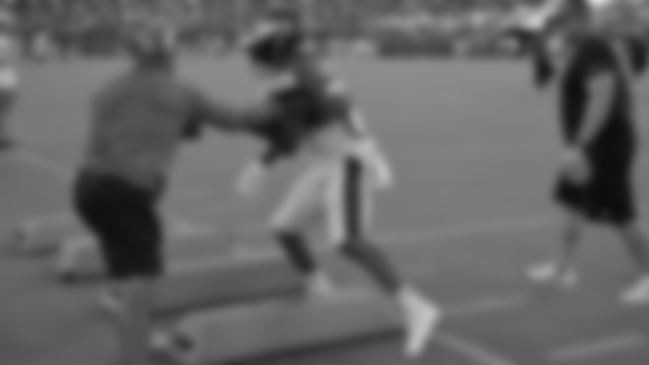 Assistant Head Coach/Running Backs Jemal Singleton goes for the knockout blow.