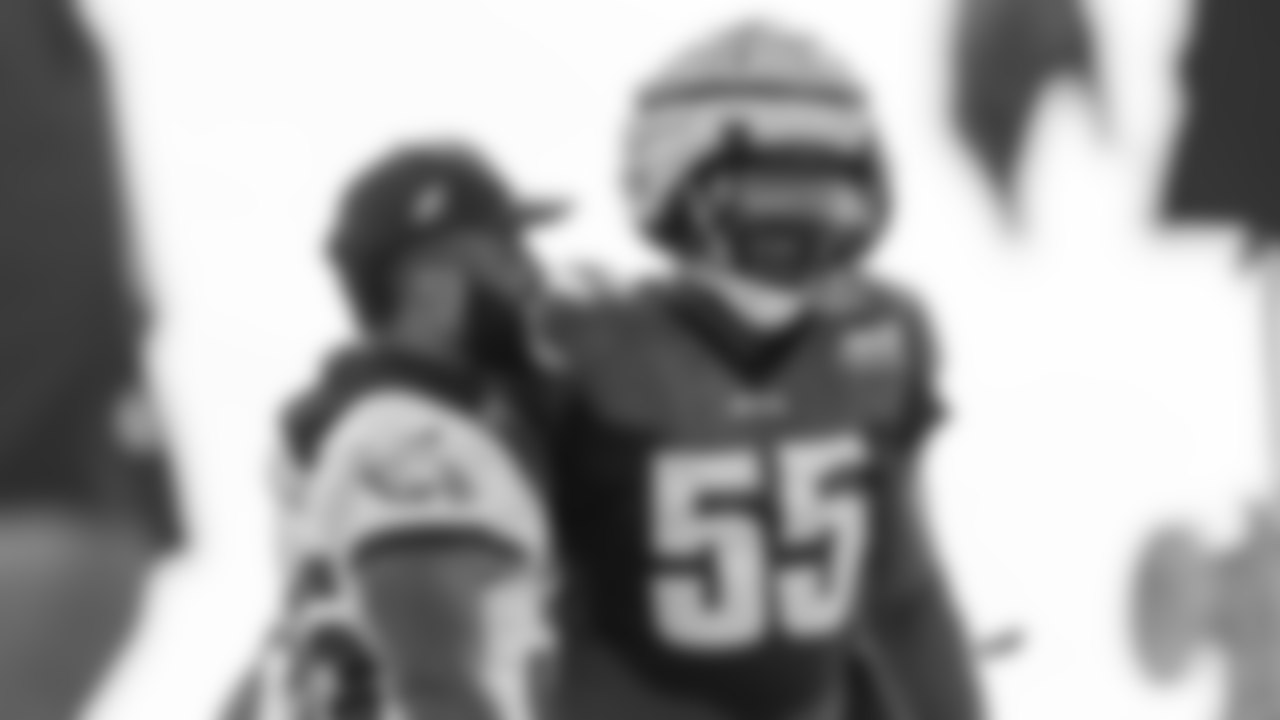 Boston Scott and Brandon Graham share a laugh at practice.