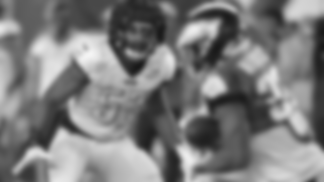 LB Davion Taylor has his eyes on the ball.