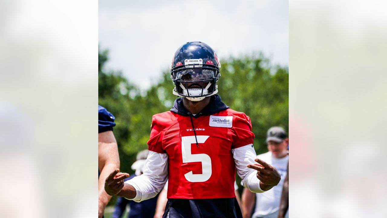 Houston Texans punter Cameron Johnston (11) tosses a bottle during warm-ups  before an NFL football game against the Jacksonville Jaguars on Sunday, Oct.  9, 2022, in Jacksonville, Fla. (AP Photo/Gary McCullough Stock