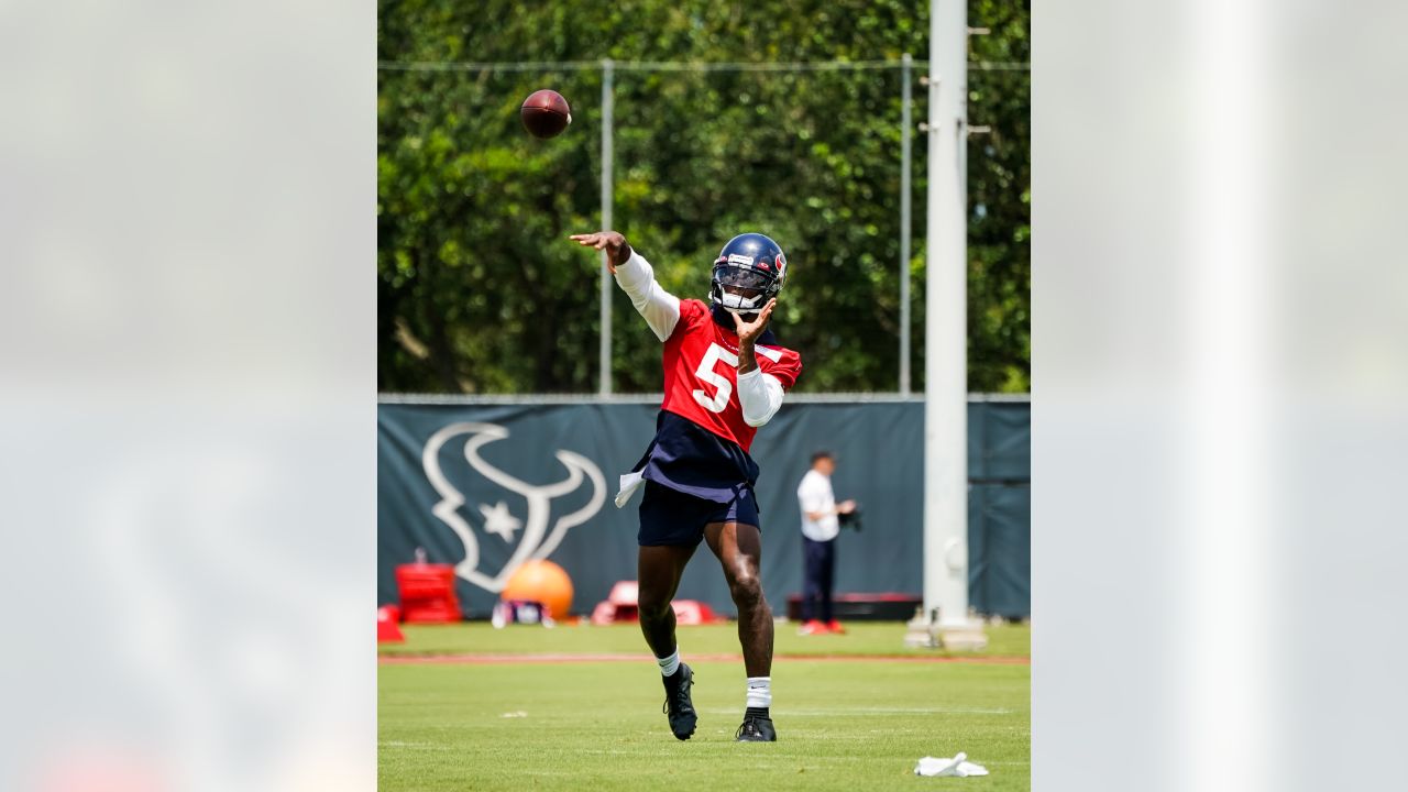 Houston Texans punter Cameron Johnston (11) tosses a bottle during warm-ups  before an NFL football game against the Jacksonville Jaguars on Sunday, Oct.  9, 2022, in Jacksonville, Fla. (AP Photo/Gary McCullough Stock