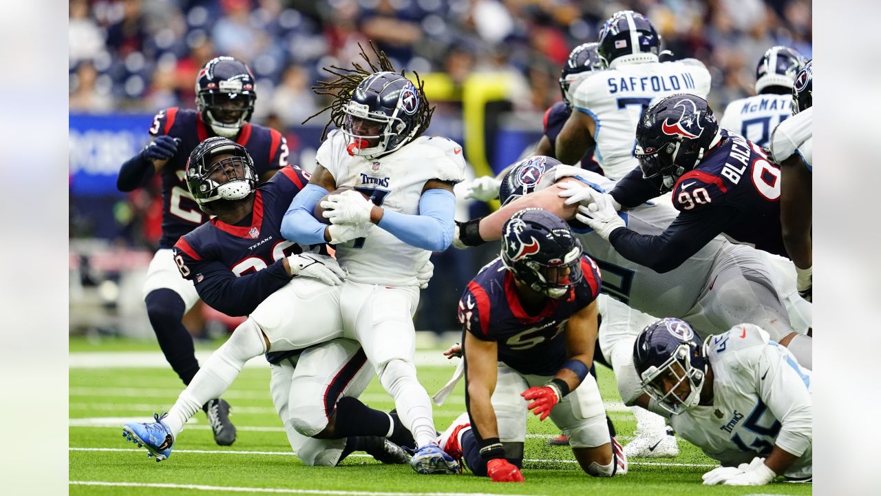 January 9, 2022: Tennessee Titans quarterback Ryan Tannehill (17) escapes a  would-be sack by Houston Texans defensive end Jacob Martin (54) during an  NFL game on Jan. 9, 2022 in Houston, Texas.