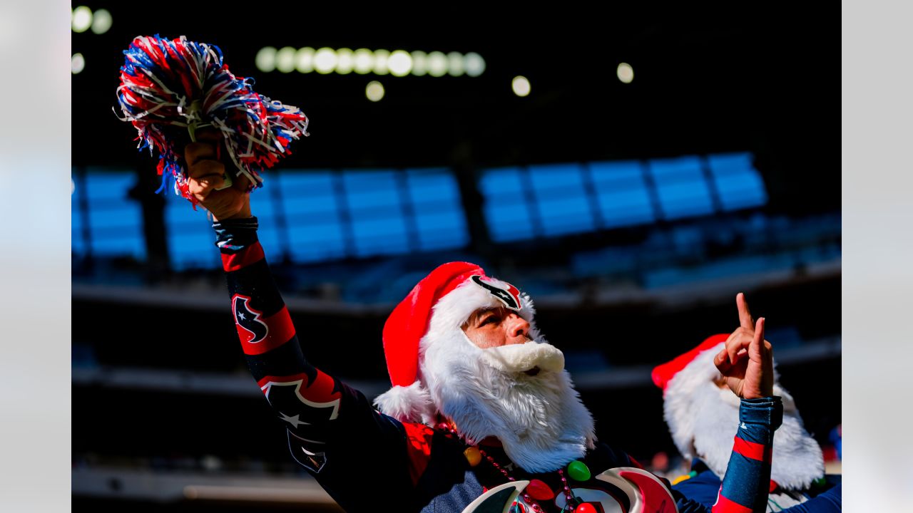 Dallas Cowboys cheerleader performs at halftime in her Santa Claus