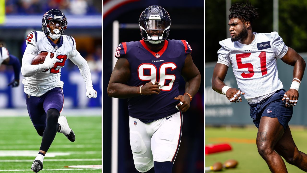 Houston Texans defensive tackle Thomas Booker IV (56) in between