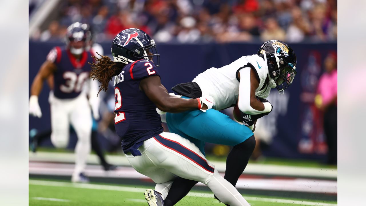 Houston, Texas, USA. 1st Jan, 2023. Jacksonville Jaguars running back  JaMycal Hasty (22) carries the ball while being tackled by Houston Texans  linebacker Christian Harris (48) during the game between the Houston