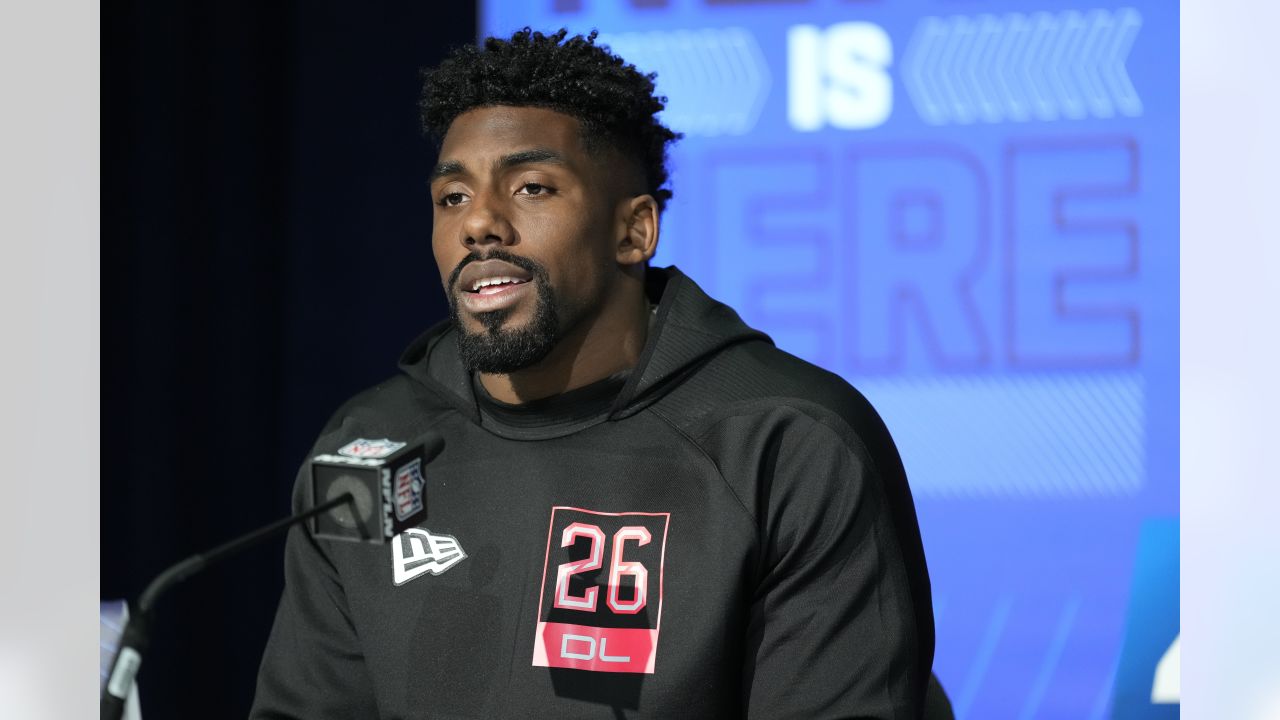 Thomas Booker says his face lit up when he received the call from the  Houston Texans during Day 3 of the 2022 NFL Draft on Saturday.