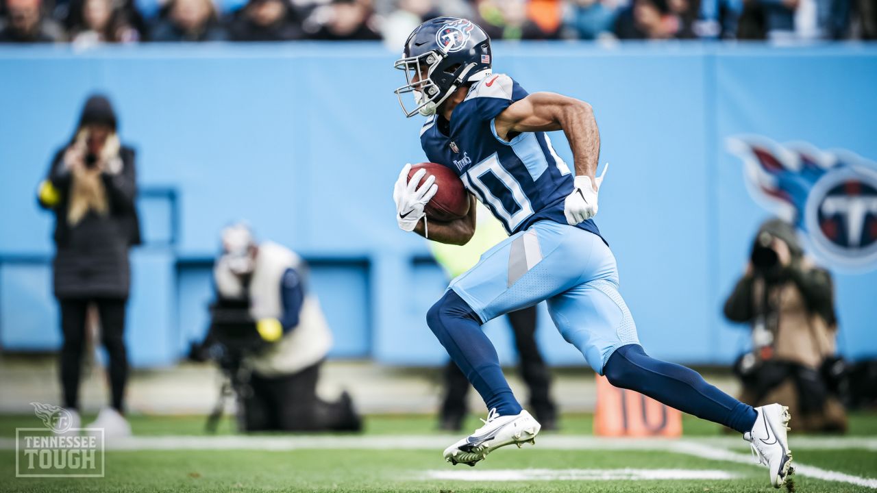 Titans light blue jersey, light blue pants and navy socks Browns