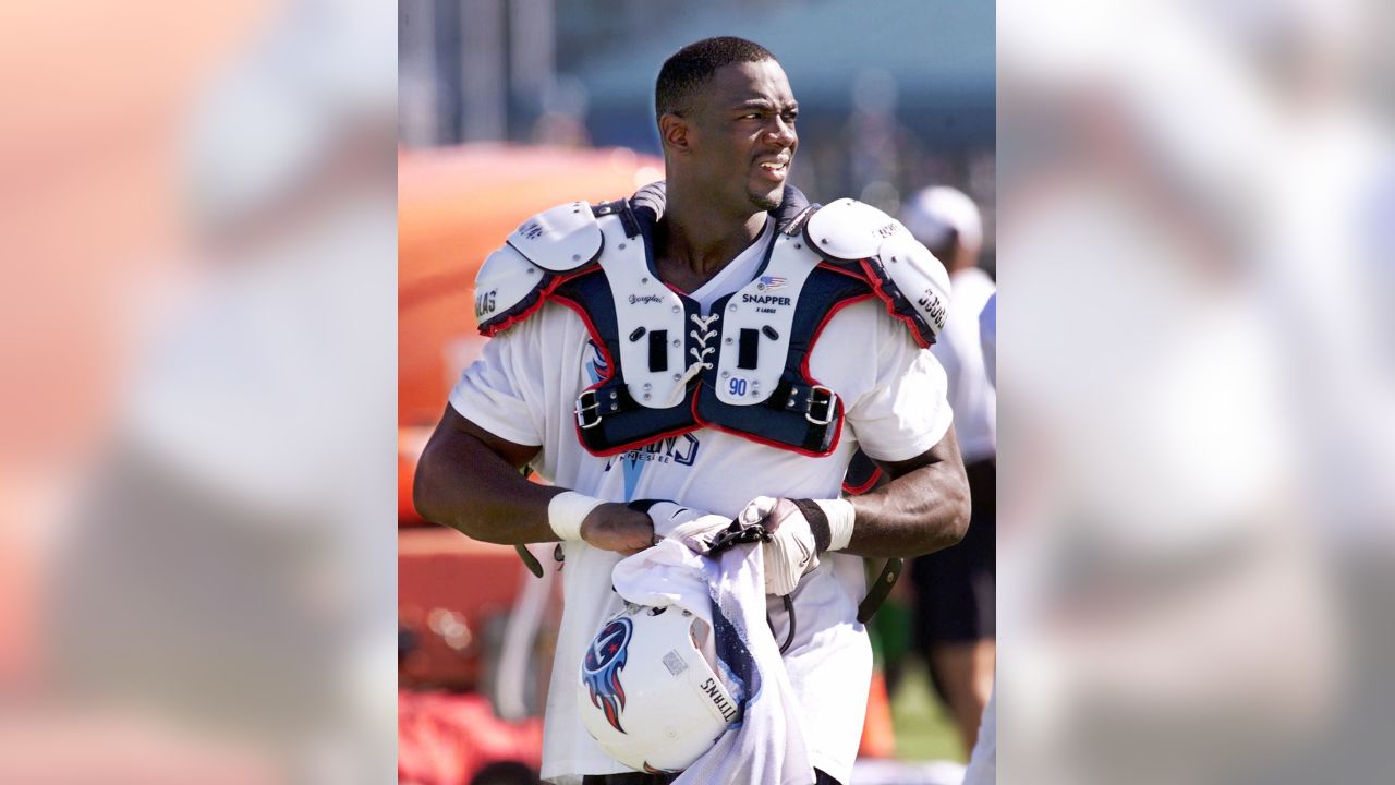 Tennessee Titans defensive end Jevon Kearse (90) talks with Tampa Bay  Buccaneers running back Derrick Ward (28) after an NFL pre-season football  game in Nashville, Tenn., Saturday, Aug. 15, 2009. The Titans