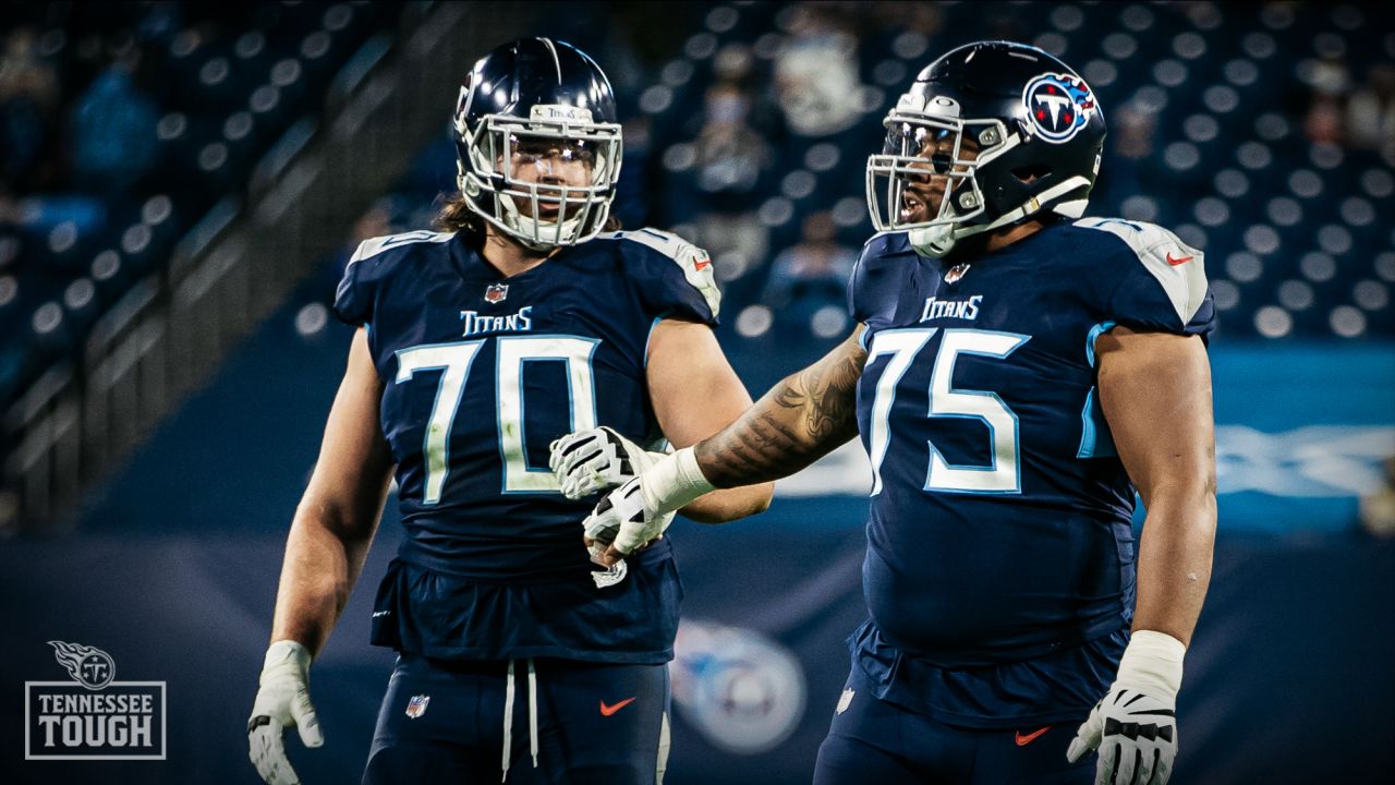 Tennessee Titans offensive tackle Ty Sambrailo (70) walks onto the field to  congratulate teammates after a touchdown during the second half of a  preseason NFL football game against the Tampa Bay Buccaneers