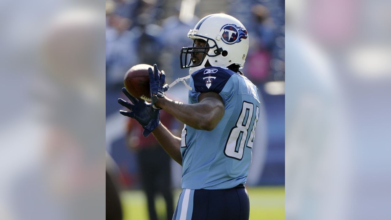 Tennessee Titans wide receiver Randy Moss (84) watches from the