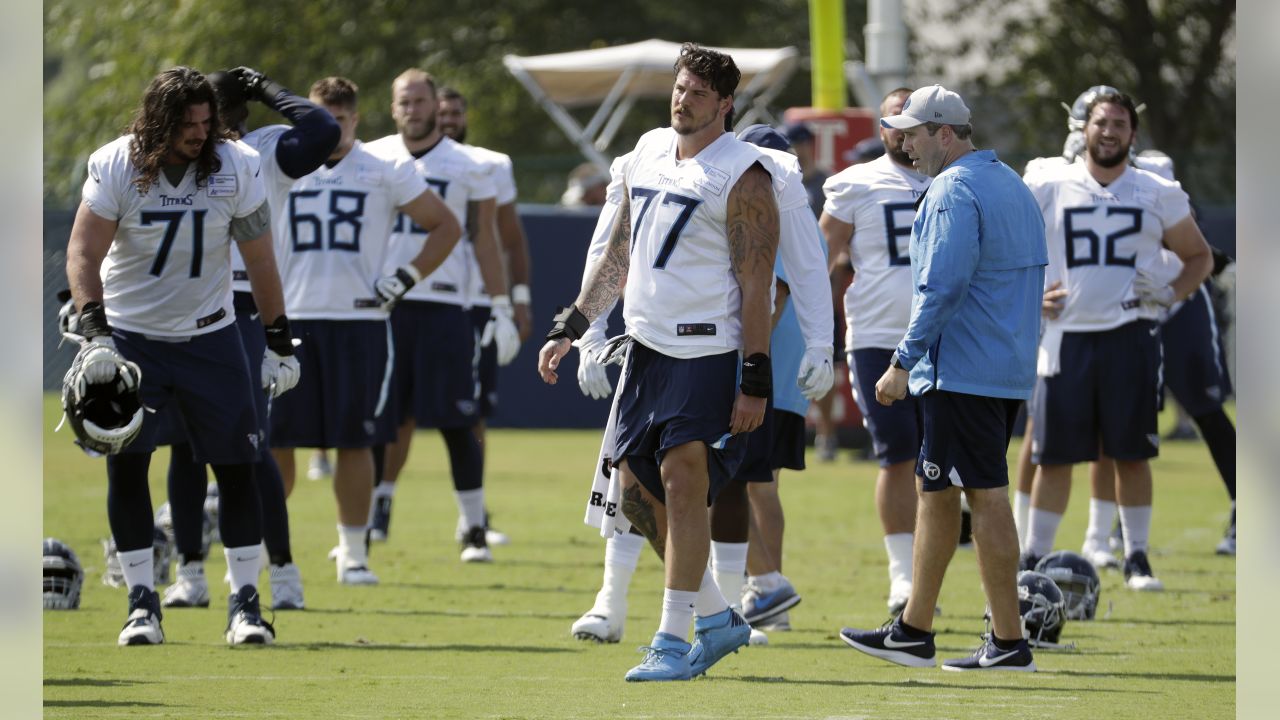 Tennessee Titans tackle Taylor Lewan (77) warms up during training camp at  the NFL football team's practice facility Wednesday, July 27, 2022, in  Nashville, Tenn. (AP Photo/Mark Humphrey Stock Photo - Alamy