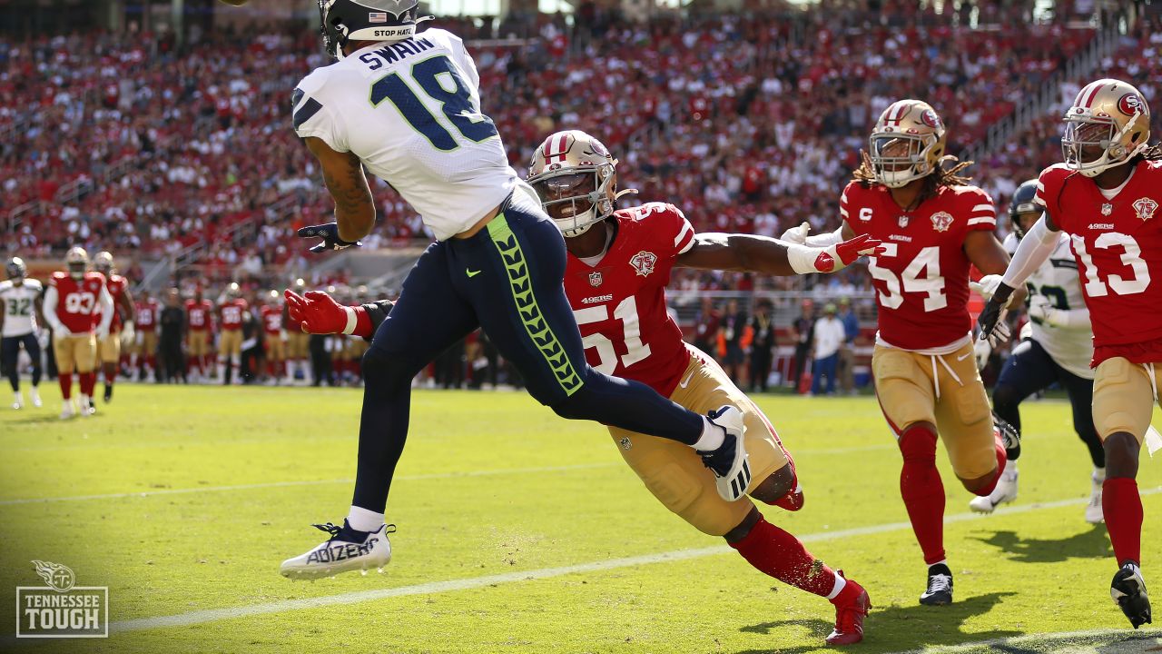 Tennessee Titans linebacker Azeez Al-Shaair, left, walks off the