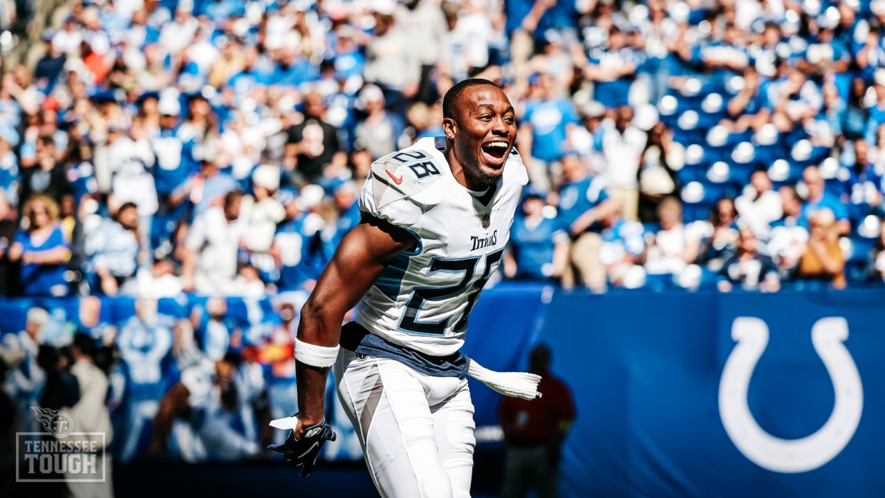 Tennessee Titans vs. Indianapolis Colts. Fans support on NFL Game.  Silhouette of supporters, big screen with two rivals in background. Stock  Photo