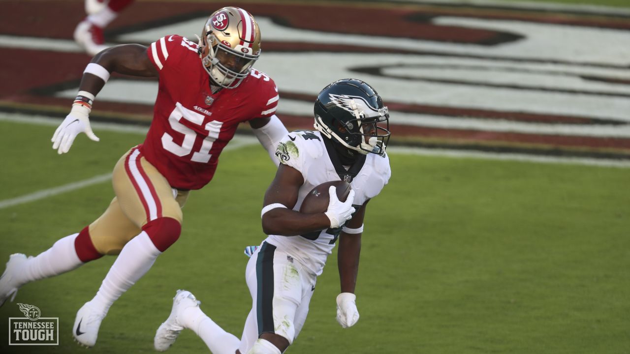 Tennessee Titans linebacker Azeez Al-Shaair, left, walks off the