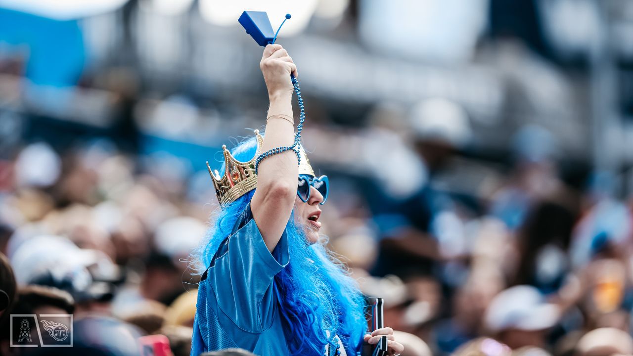 Tennessee Titans vs. Indianapolis Colts. Fans support on NFL Game.  Silhouette of supporters, big screen with two rivals in background. Stock  Photo