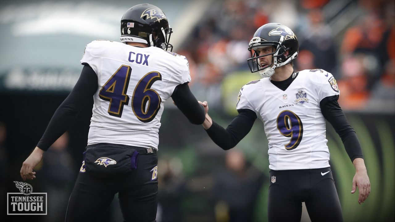 Baltimore Ravens long snapper Morgan Cox (46) waits to take the field while  holding a flag as part of the team's Salute to Service prior to an NFL  football game against the