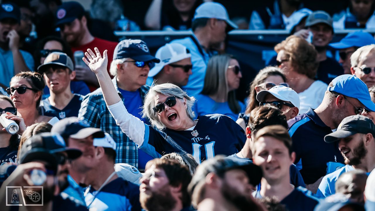 Tennessee Titans vs. Indianapolis Colts. Fans support on NFL Game.  Silhouette of supporters, big screen with two rivals in background. Stock  Photo