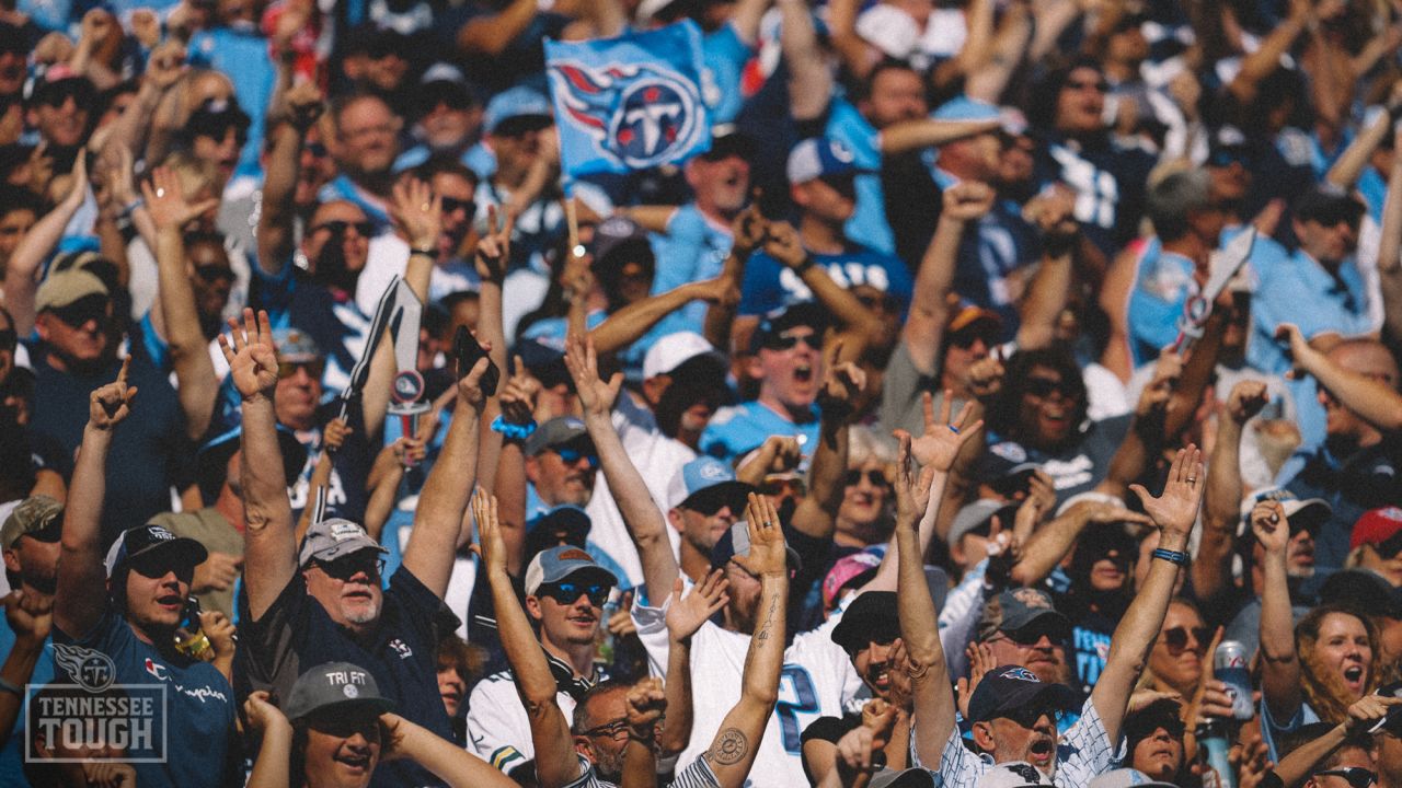 Tennessee Titans vs. Indianapolis Colts. Fans support on NFL Game.  Silhouette of supporters, big screen with two rivals in background. Stock  Photo