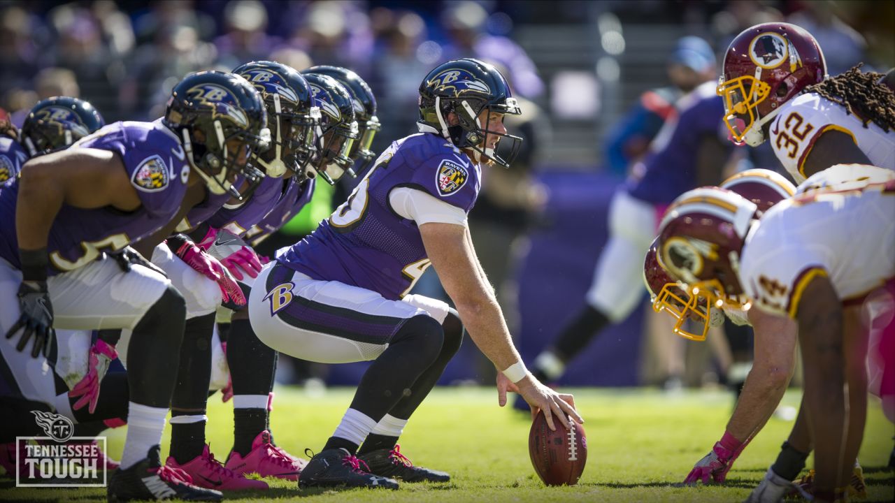 Baltimore Ravens long snapper Morgan Cox (46) waits to take the field while  holding a flag as part of the team's Salute to Service prior to an NFL  football game against the