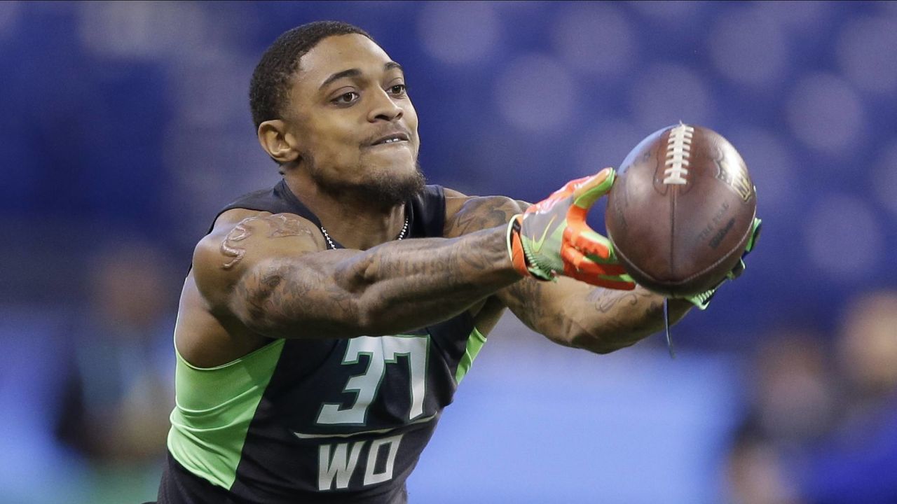 NFC wide receiver CeeDee Lamb of the Dallas Cowboys tosses a ball to a  teammate during Pro Bowl NFL football practice, Friday, February 4, 2022,  in Las Vegas. (Gregory Payan/AP Images for