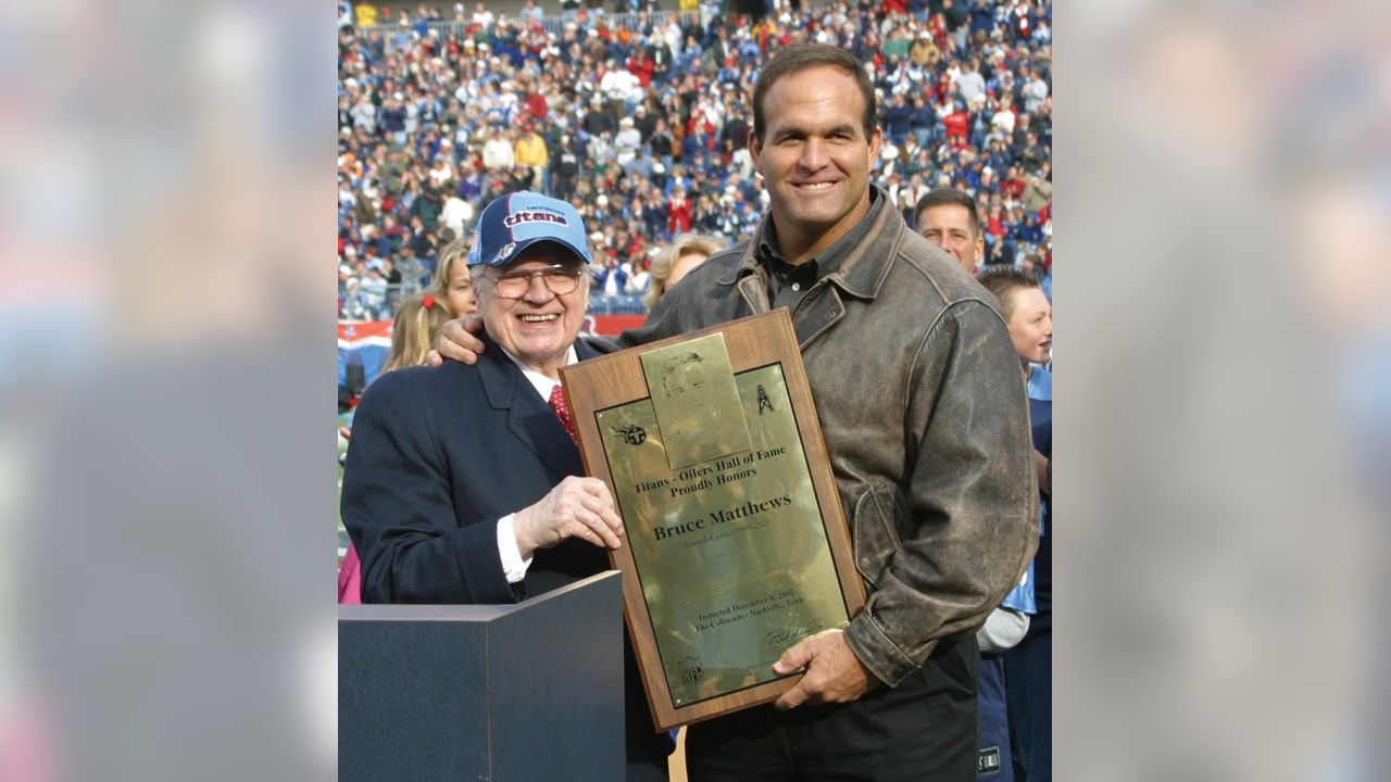 Retired Tennessee Titans offensive lineman Bruce Matthews, left, stands  with his wife, Carrie, and their youngest son, Luke, during a ceremony  where Matthews' number 74 was retired on Sunday, Dec. 8, 2002