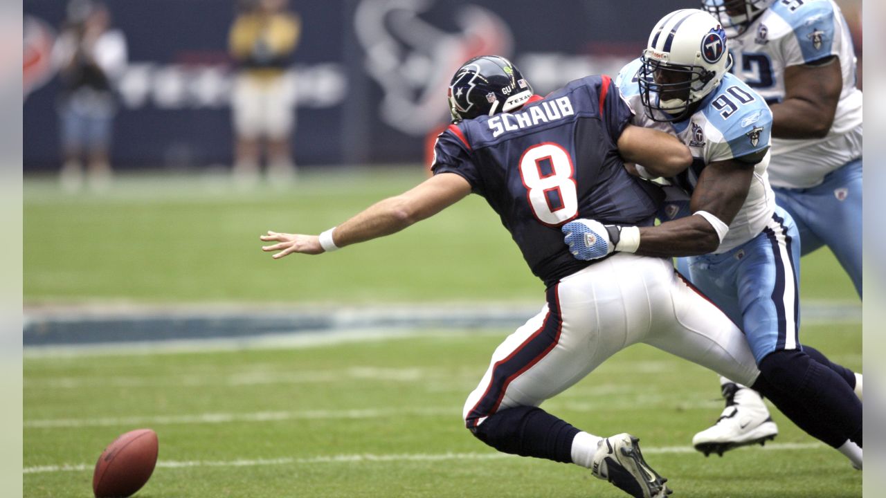 Tennessee Titans defensive end Jevon Kearse (90) knocks the ball out of the  hands of Houston Texans quarterback Matt Schaub (8) during the first  quarter of an NFL football game Sunday, Dec.