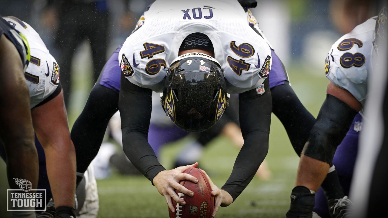 Baltimore Ravens long snapper Morgan Cox (46) waits to take the field while  holding a flag as part of the team's Salute to Service prior to an NFL  football game against the