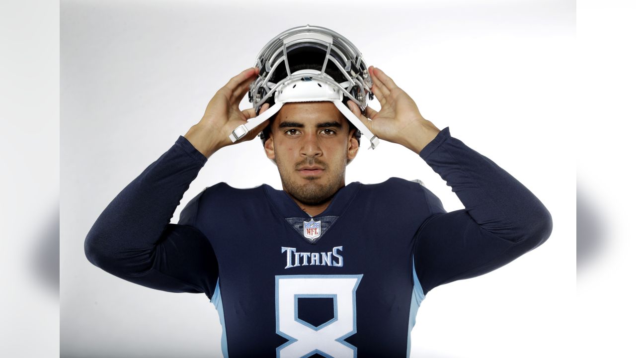 November 05, 2018:.Tennessee Titans quarterback Marcus Mariota (8)  scrambles for a first down during an NFL football game between the  Tennessee Titans and Dallas Cowboys at AT&T Stadium in Arlington, Texas.  Manny