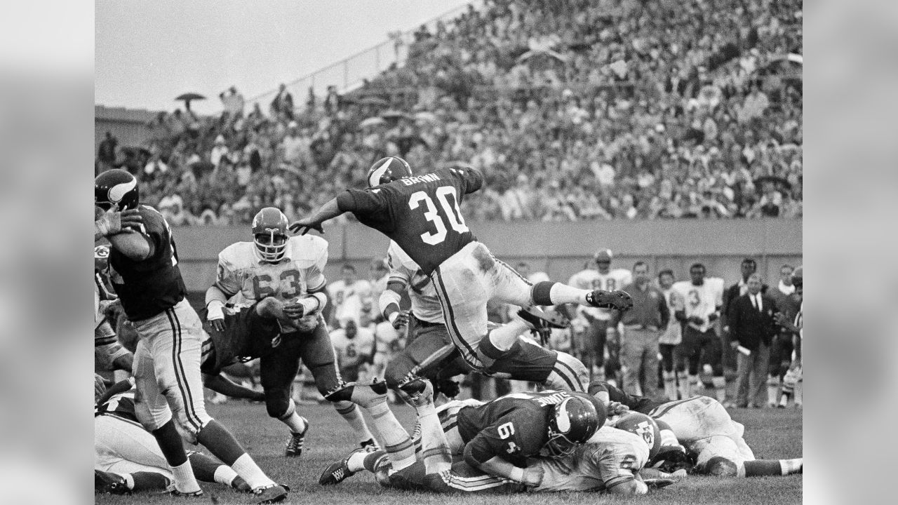 Minnesota Vikings running back Bill Brown, left, has his hand out to  congratulate quarterback Joe Kapp after Kapp scored his first touchdown to  defeat of the Cleveland Browns, 27-7 for the NFL