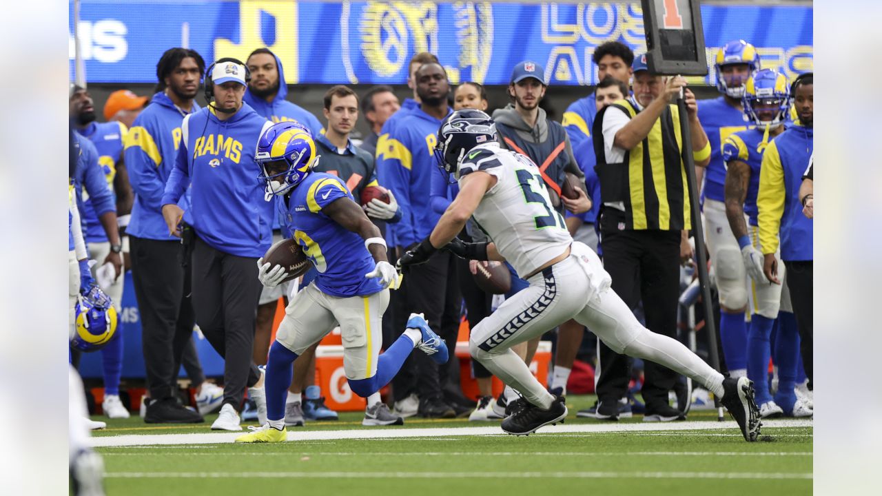 Brandon Powell of the Los Angeles Rams runs with the ball as