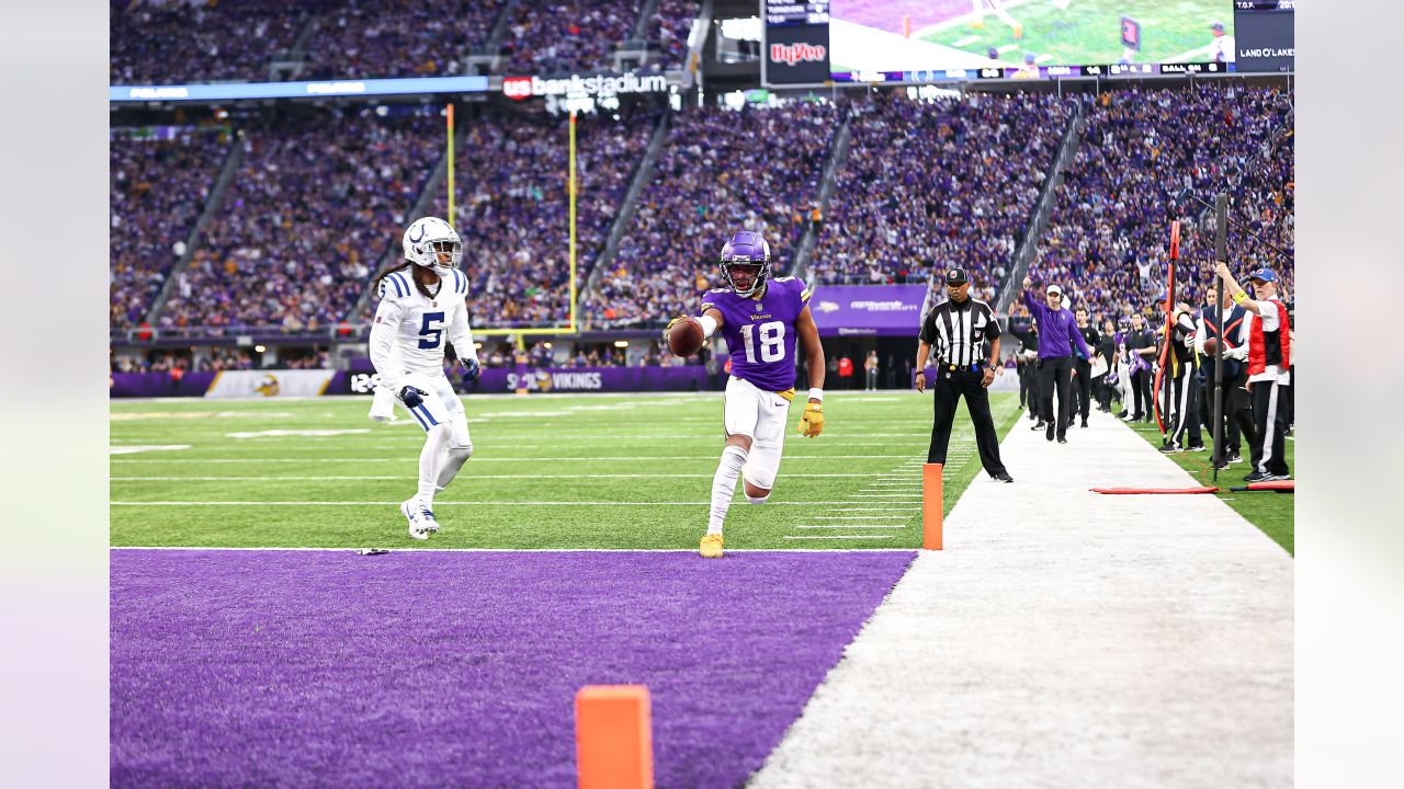 Indianapolis Colts vs. Minnesota Vikings. Fans support on NFL Game.  Silhouette of supporters, big screen with two rivals in background. Stock  Photo