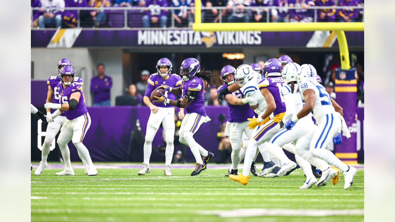 Indianapolis Colts vs. Minnesota Vikings. Fans support on NFL Game.  Silhouette of supporters, big screen with two rivals in background. Stock  Photo