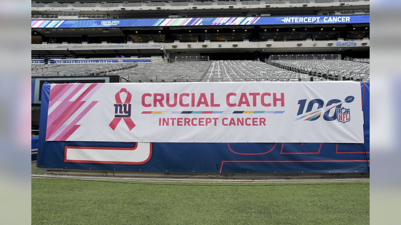 A goal post is wrapped in a Crucial Catch banner during an NFL