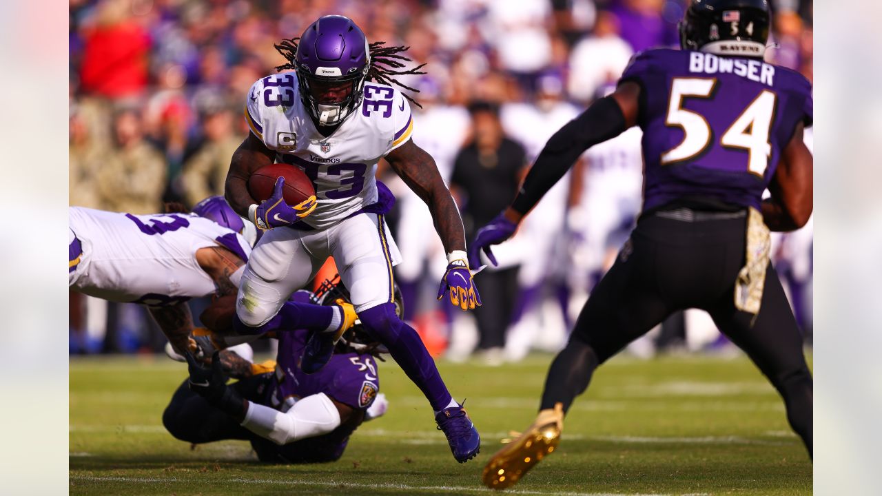 DETROIT, MI - DECEMBER 11: Minnesota Vikings running back Dalvin Cook (4)  runs with the ball through Detroit defenders during the second quarter of  an NFL football game between the Minnesota Vikings