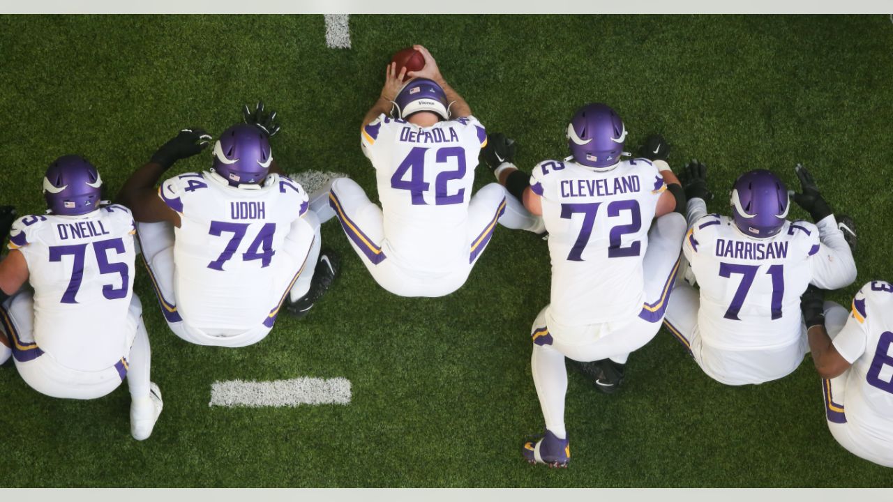 Minnesota Vikings punter Ryan Wright (14) and long snapper Andrew DePaola  (42) chat as they warm-up before an NFL match between Minnesota Vikings and  New Orleans Saints at the Tottenham Hotspur stadium