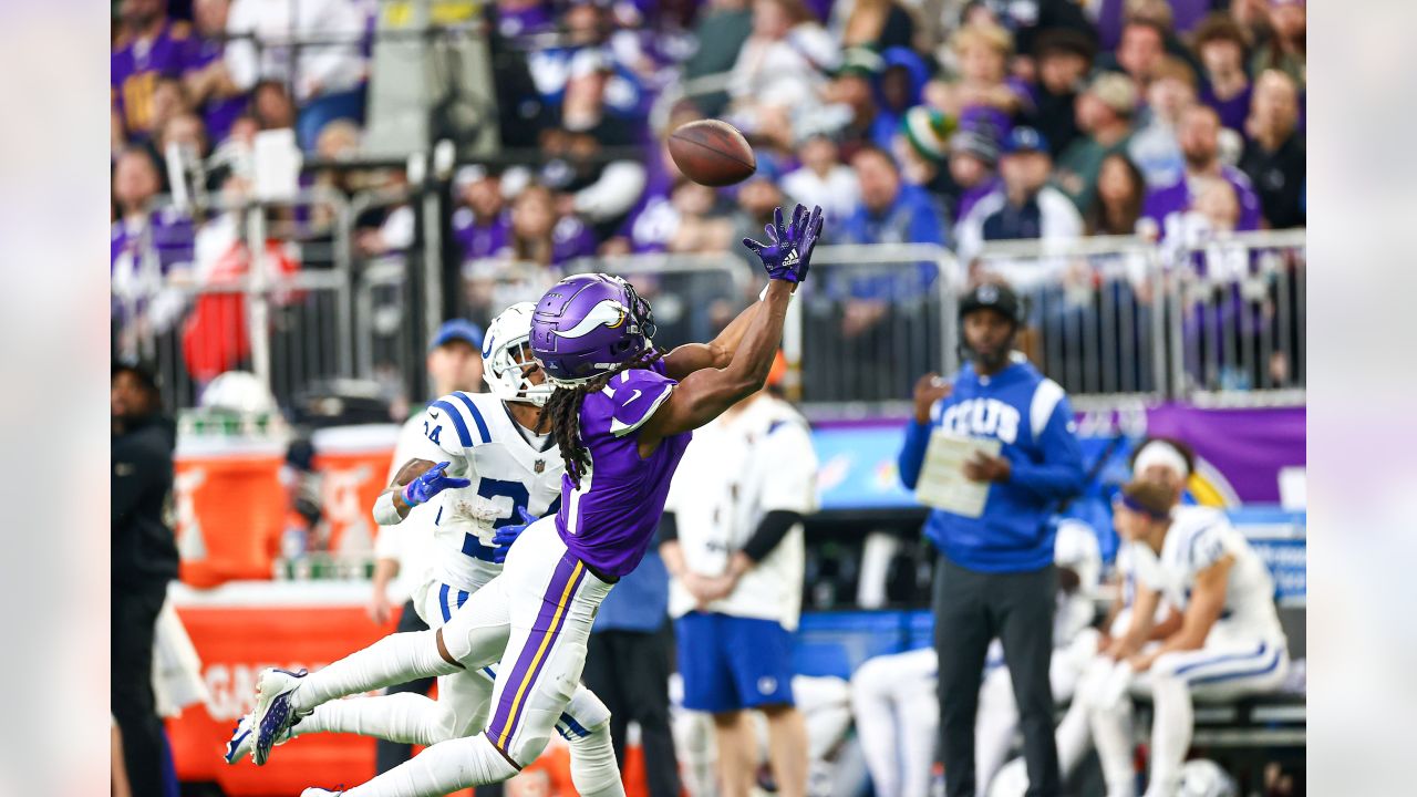 Indianapolis Colts vs. Minnesota Vikings. Fans support on NFL Game.  Silhouette of supporters, big screen with two rivals in background. Stock  Photo