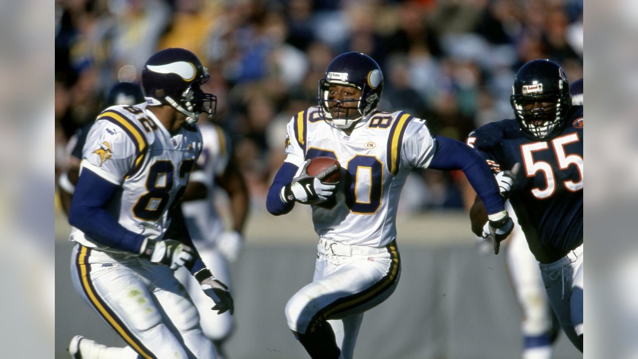 Minnesota Vikings receiver Cris Carter points to the roof as he kneels down  in the end zone following a touchdown in the second quarter Sunday, Nov.  22, 1998, in Minneapolis. The Vikings