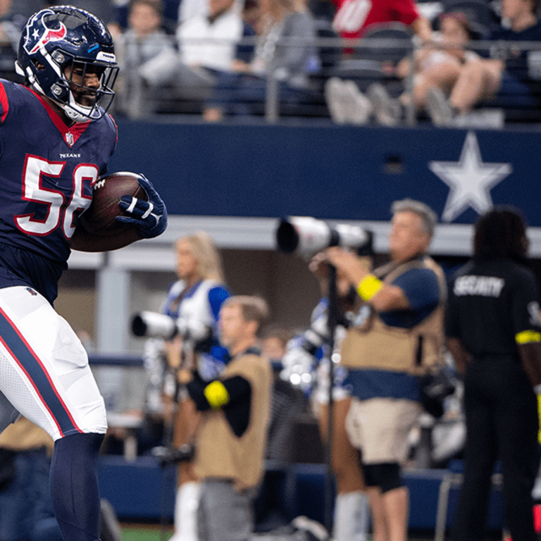 Houston Texans defensive tackle Thomas Booker IV (56) in between