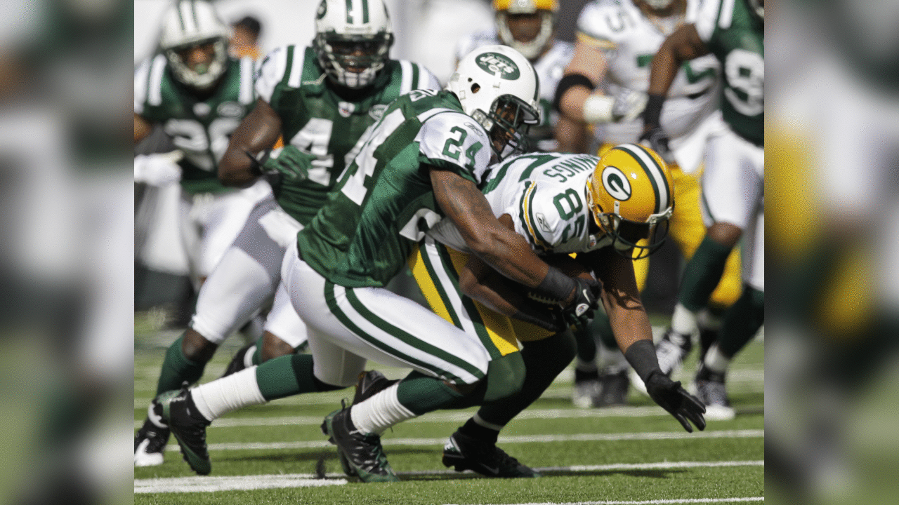 New York Jets cornerback Darrelle Revis (24) tackles Green Bay Packers wide receiver Greg Jennings (85) after Jennings made a first down during the first quarter of an NFL football game at New Meadowlands, Stadium Sunday, Oct. 31, 2010, in East Rutherford, N.J. (AP Photo/Kathy Willens)