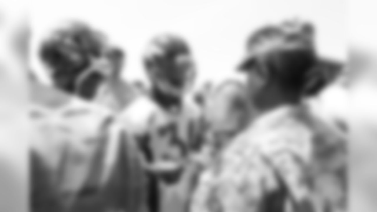Safety Will Parks (34) meets military members of the Colorado Air National Guard and the U.S. Army after practice on June 12, 2018. The meet-and-greet was part of an event hosting servicemen and servicewomen with USAA and the Broncos Womens Organization.