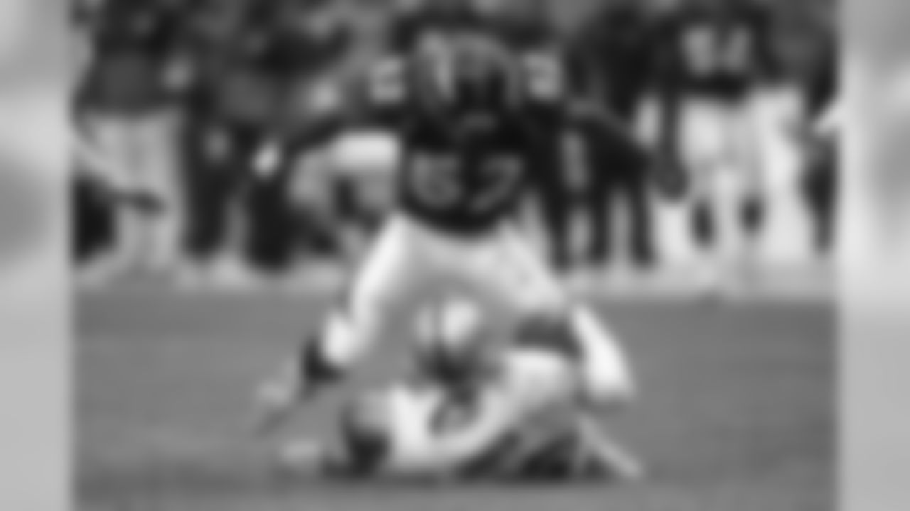 Ian Gold celebrates after sacking Rich Gannon against the Oakland Raiders at Invesco Field at Mile High in Denver, CO on December 30, 2001.