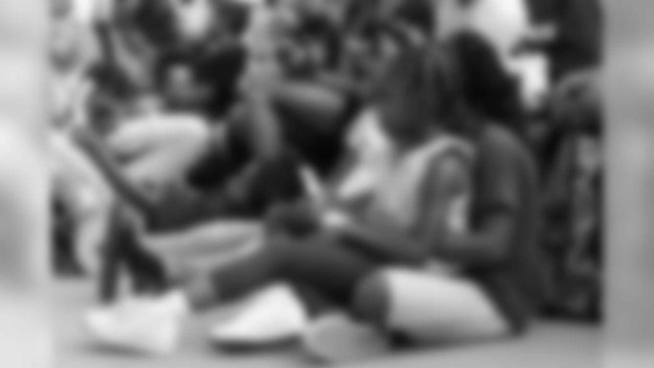 Children listen to speeches at the Denver Broncos Boys & Girls Club's 15th anniversary celebration on August 2, 2018.