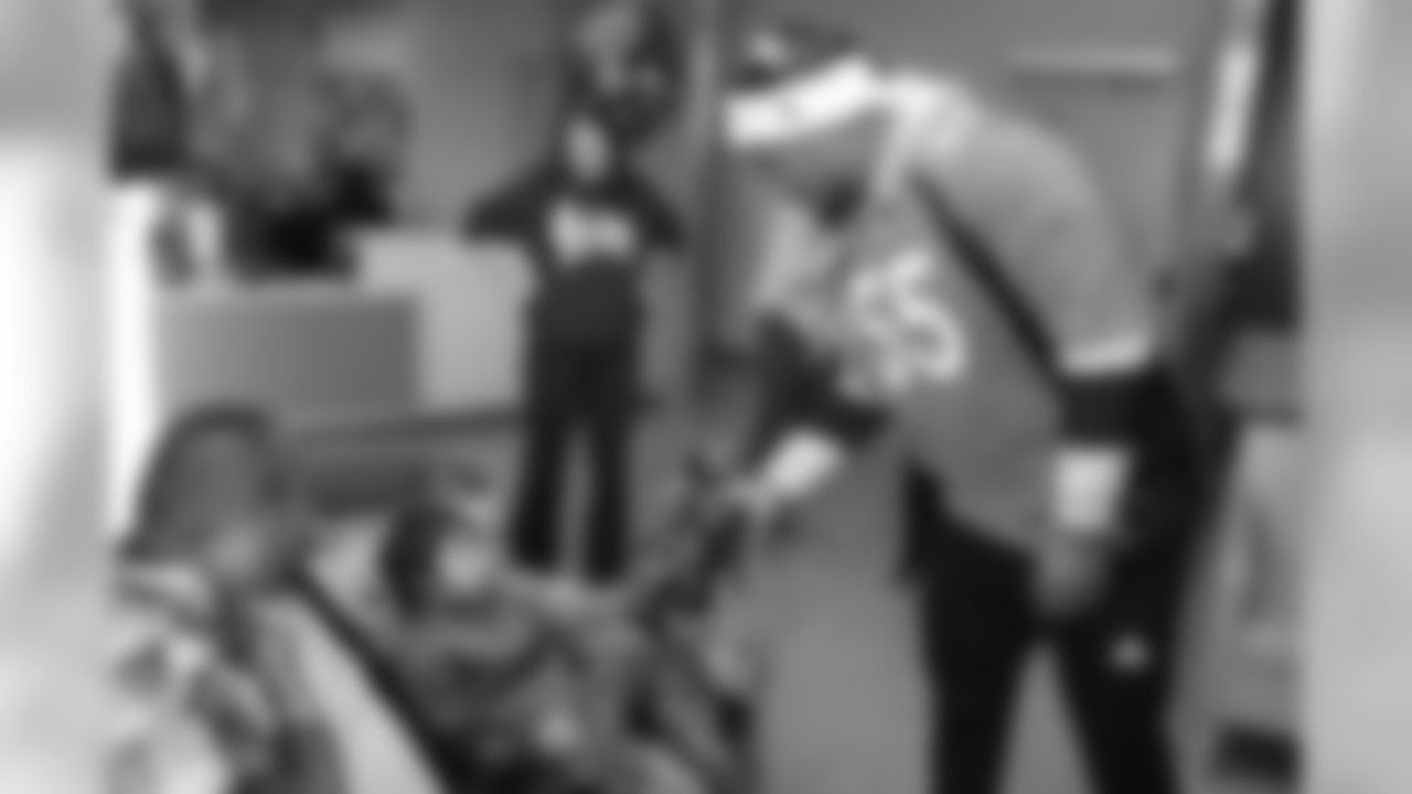 Bradley Chubb delivers a bear during a Build-A-Bear distribution at Children's Hospital Colorado in Aurora on December 17, 2018.
