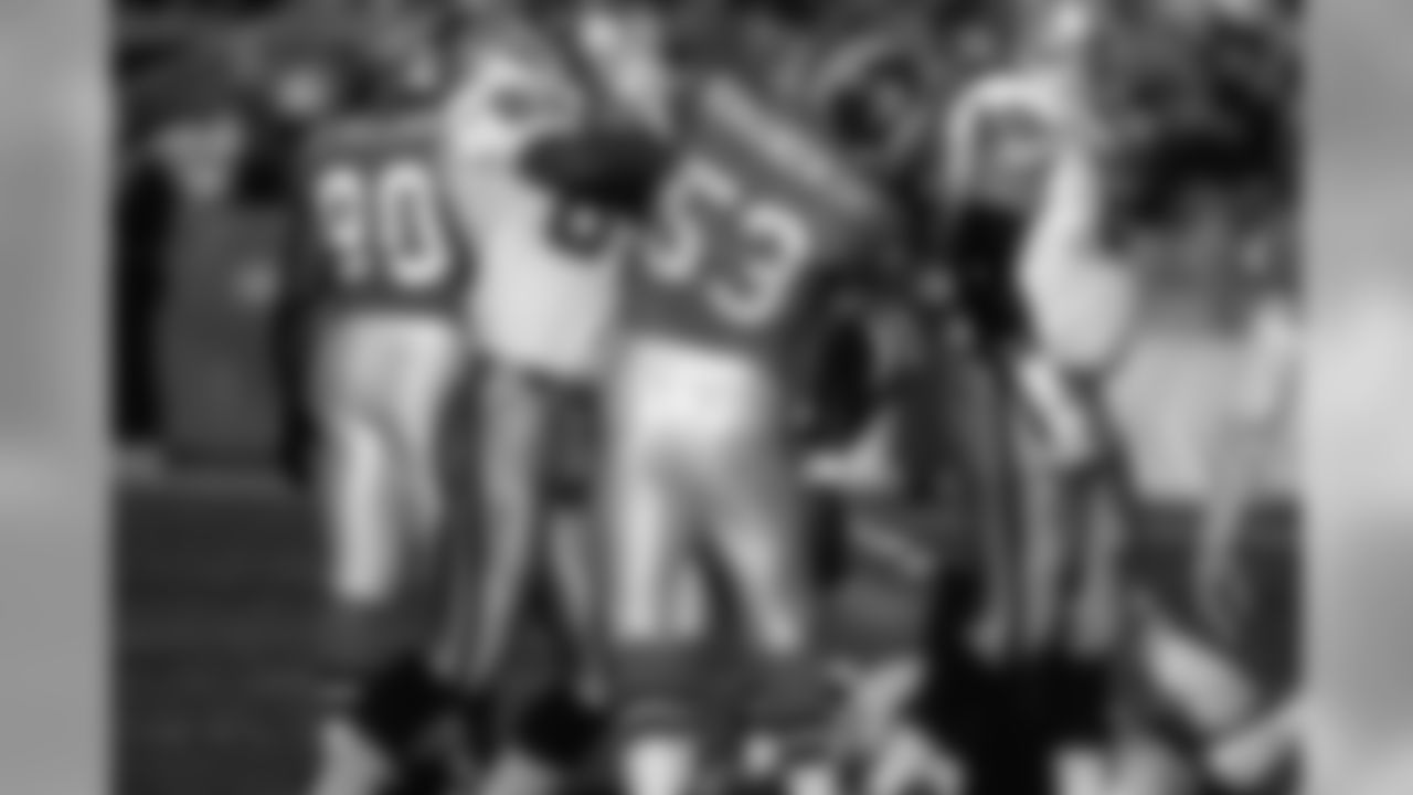 Linebacker Bill Romanowski scuffles with a Raider during a December 15, 1996 win (24-19) over Oakland.