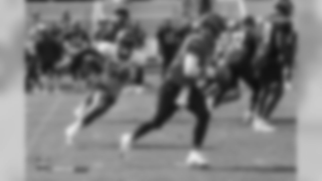 Outside linebacker Von Miller (58) chases Bears QB Mitchell Trubisky during a joint training camp practice with the Chicago Bears at UCHealth Training Center on August 16, 2018.