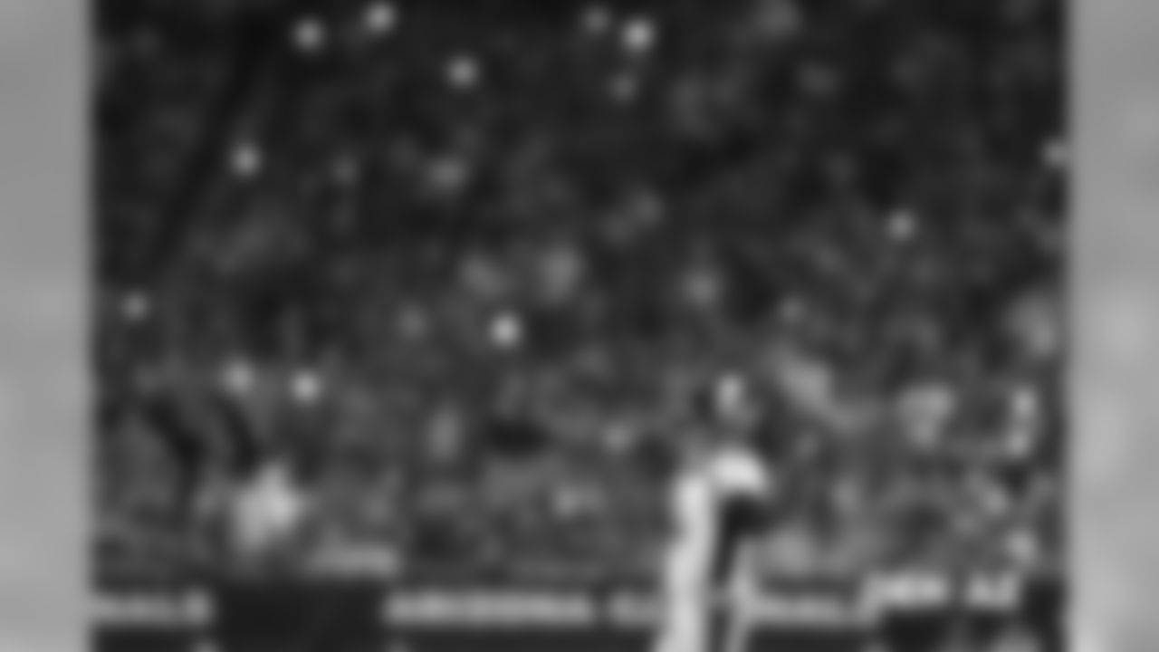 As fans turn on their phones' flashlight features and shine them toward the field during a break in the action, Case Keenum contemplates the Broncos' next move.